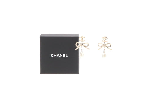 Chanel Dangle Earrings Pearl and Bow Goldtone 2022