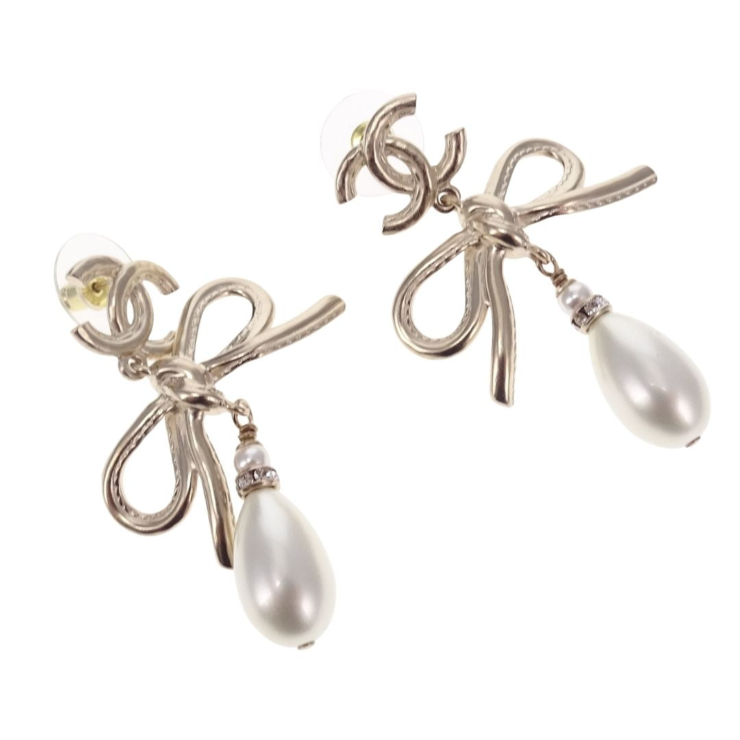 Chanel Dangle Earrings Pearl and Bow Goldtone 2022